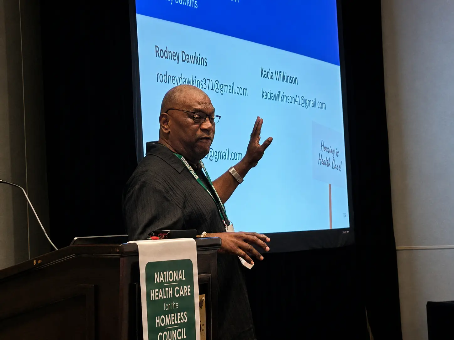 Executive Director presenting evidence and insights to conference attendees